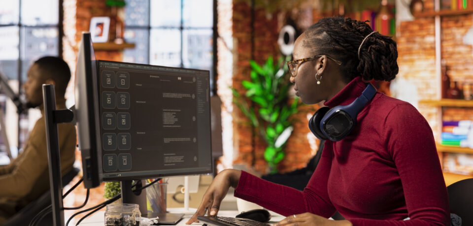 Programmer solving tasks with AI LLM chatbot answering prompts using predictive technology. Startup company worker using computer to interact with large language model program